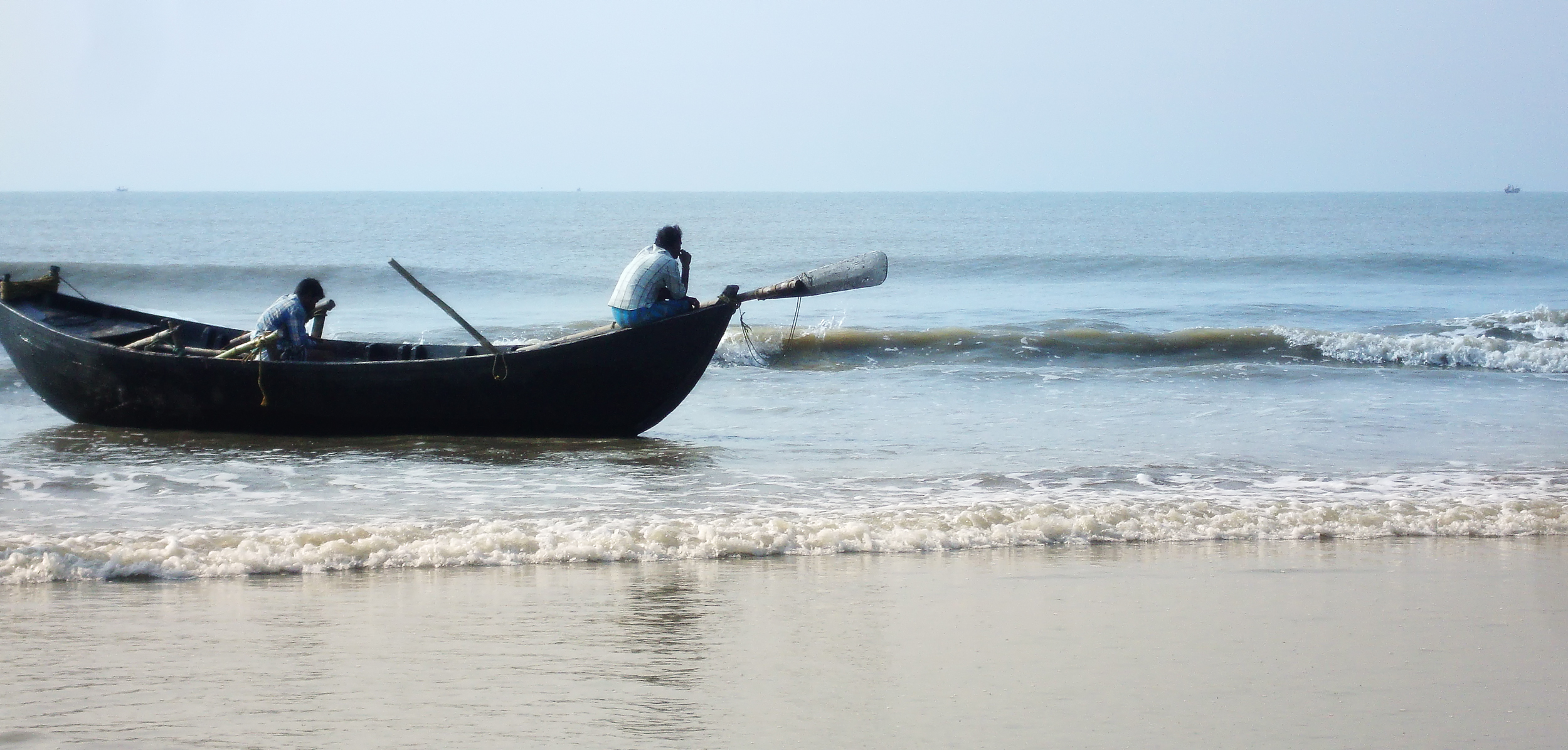 Mandarmoni beach with cars driving on sand